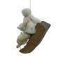 Preview: Spun cotton girl on sled, ca. 1900