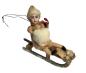 Preview: Spun cotton girl on sled, ca. 1900