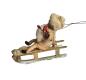 Preview: Spun cotton girl on sled, ca. 1900