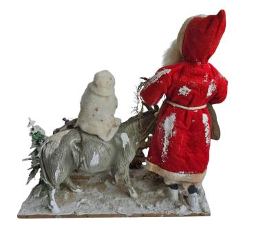 Santa Claus with donkey and Christ child in cotton clothes