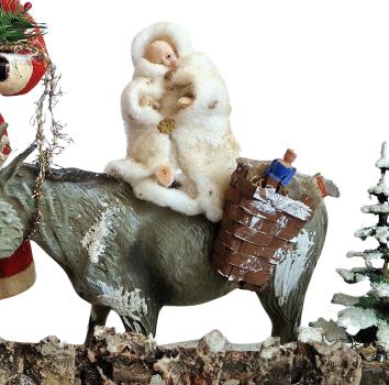 Santa Claus with donkey and Christ child in cotton clothes