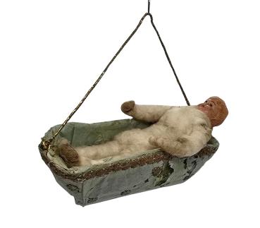 Spun Cotton figure in a basket, ca. 1900