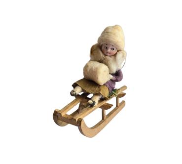 Spun cotton Heubach Girl on Sledge, ca. 1900