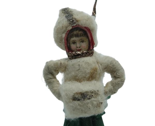 Spun cotton girl with muff, ca. 1900
