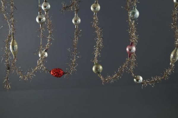 2 gold-colored Tinsel Garlands with glass  Beads,  ca. 290 cm