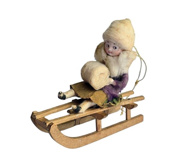 Spun cotton Heubach Girl on Sledge, ca. 1900