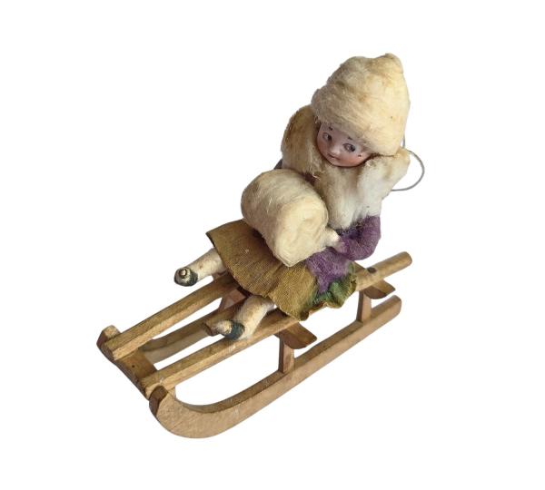 Spun cotton Heubach Girl on Sledge, ca. 1900