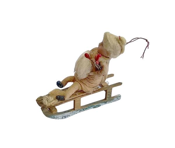 Spun cotton girl on sled, ca. 1900